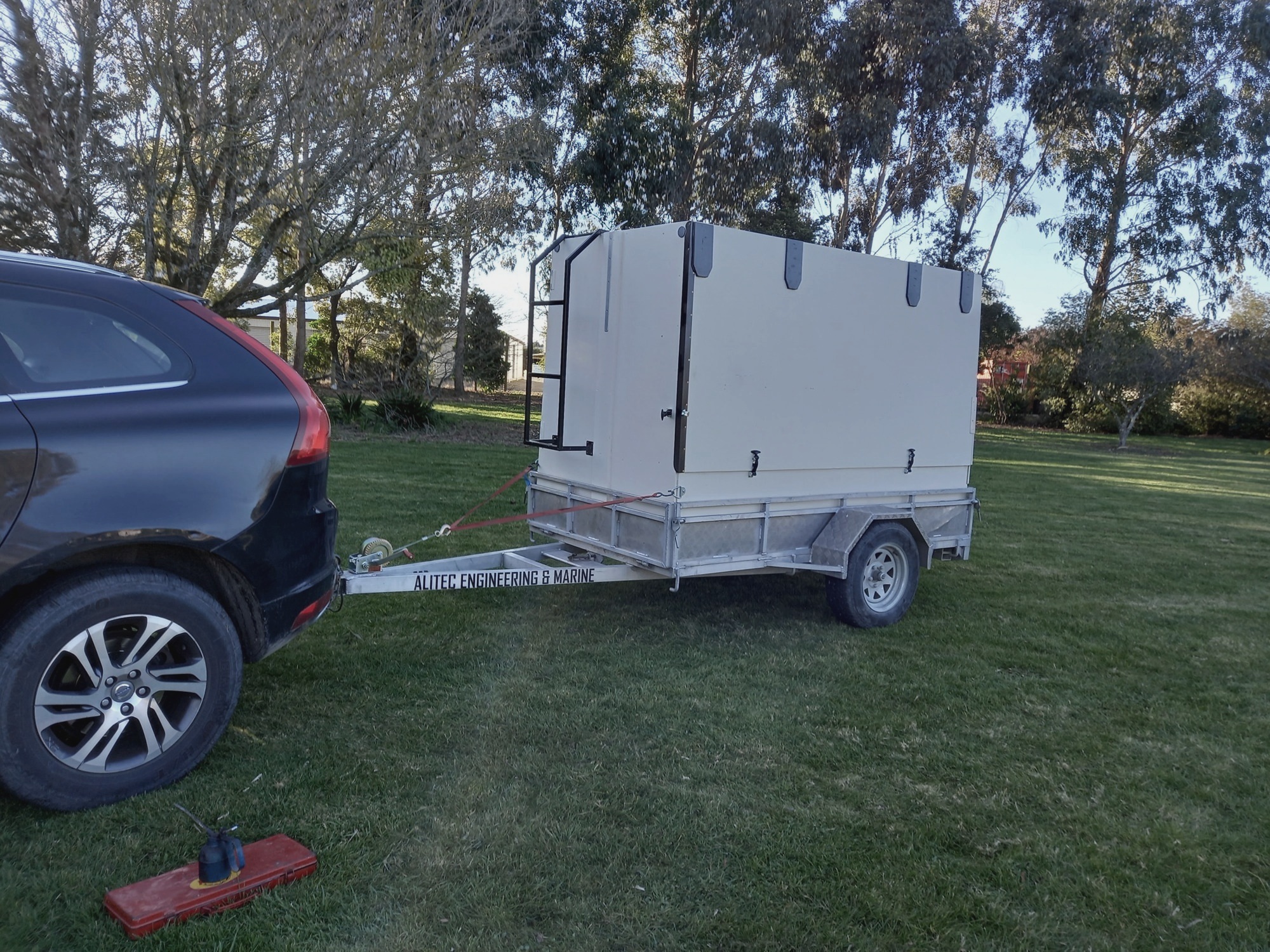 First white BBQ trailer behind the black Volvo