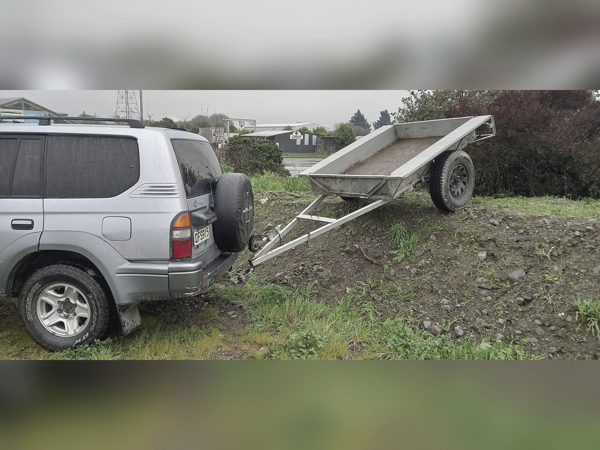 Trailer and Prado on uneven ground