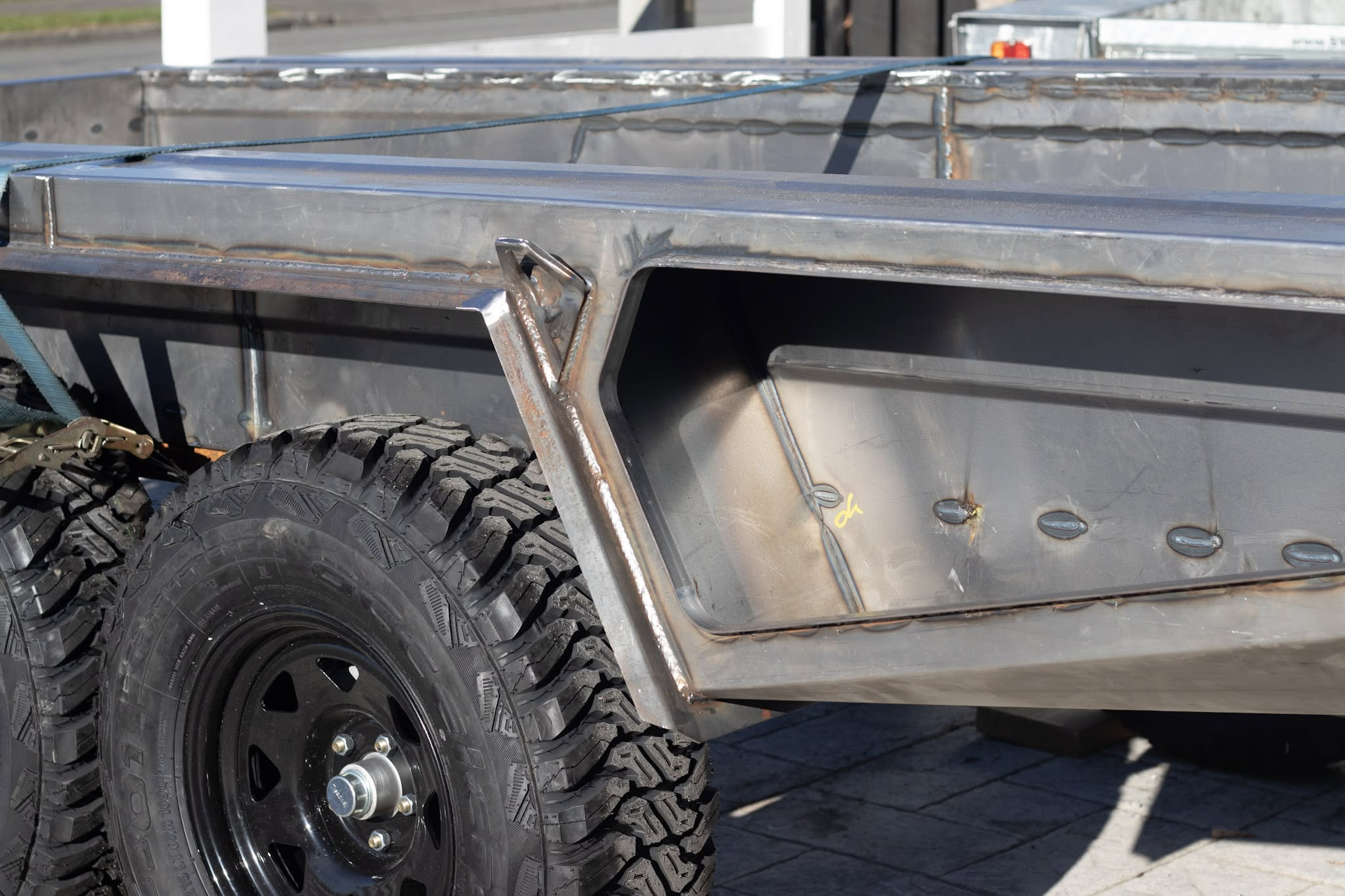 Welded trailer body and storage recess before galvanising